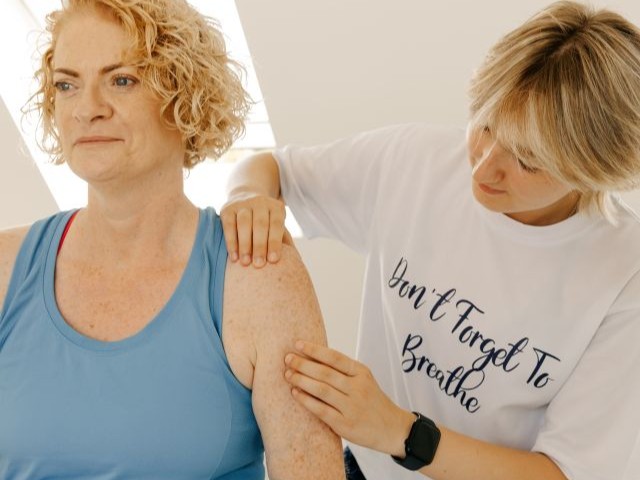 A patient receiving physiotherapy for neck and shoulder pain